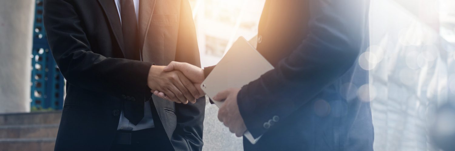 Successful negotiate and achievement concept, two business peopl Successful negotiate and achievement concept, two business people shake hand after talk and success in investment deal